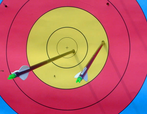 Archery target with two arrows